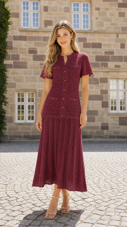 Front view of model wearing burgundy textured knit midi dress