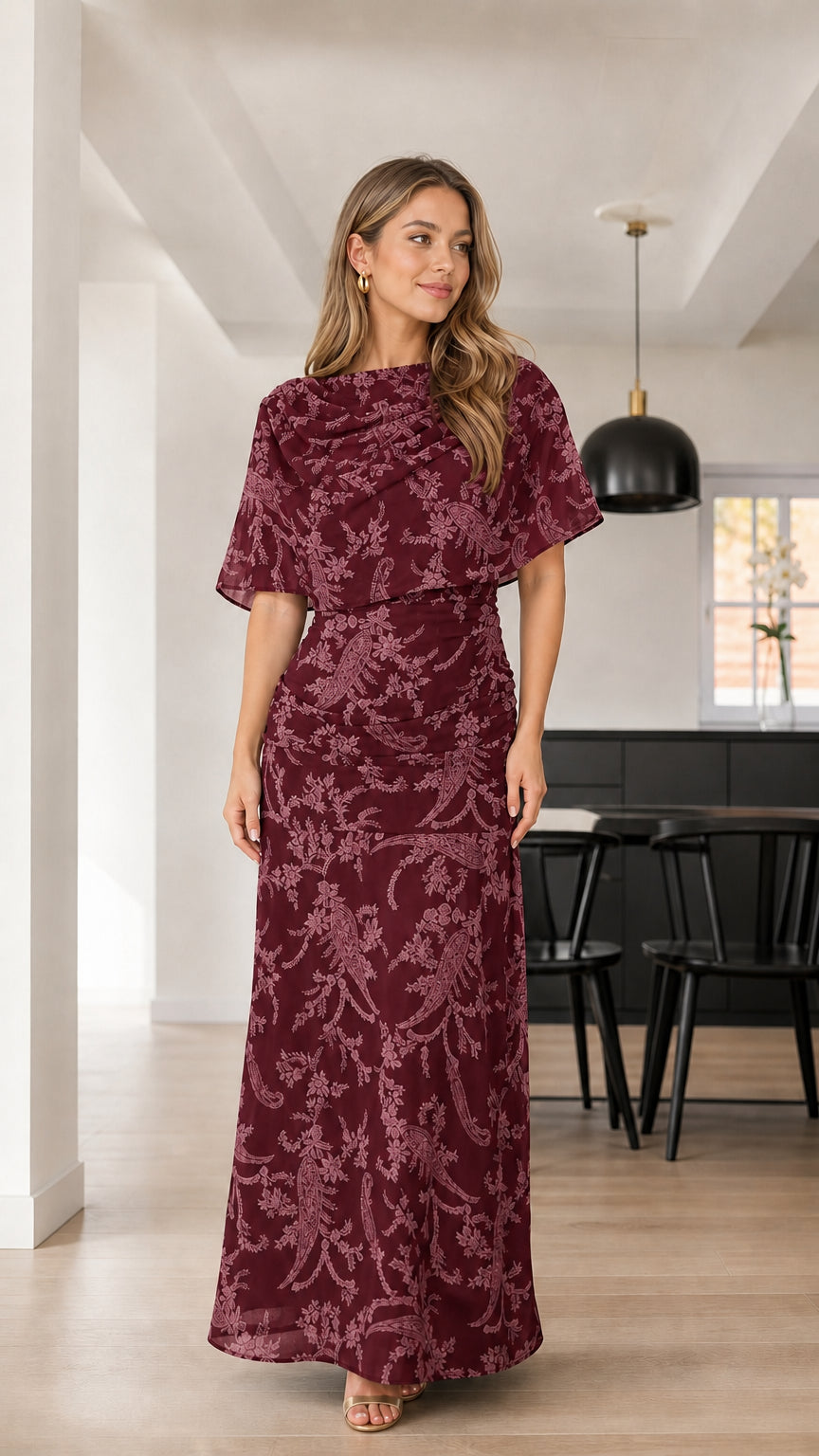 Front view of woman wearing Burgundy wine floral textured capelet maxi dress