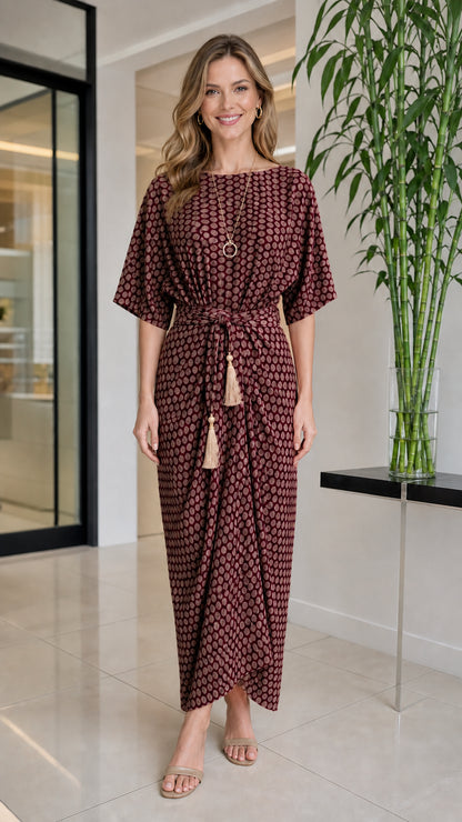 Front view of woman wearing burgundy geometric print maxi dress