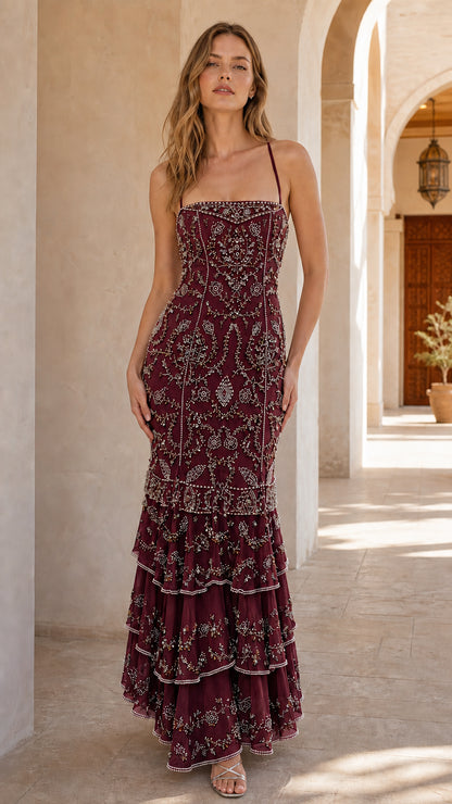 Front view of model wearing burgundy beaded evening gown