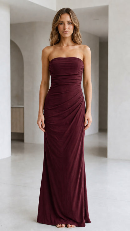 Front view of woman wearing strapless ruched maxi dress in burgundy wine