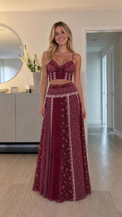 Model wearing burgundy floral patchwork two-piece set