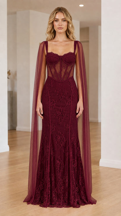 Front view of the burgundy cape corset maxi dress