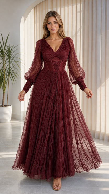 Front view of model wearing burgundy wine red corset tulle formal dress