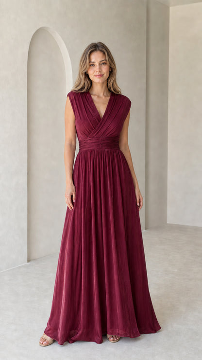Model wearing burgundy wine pleated V-neck formal maxi gown
