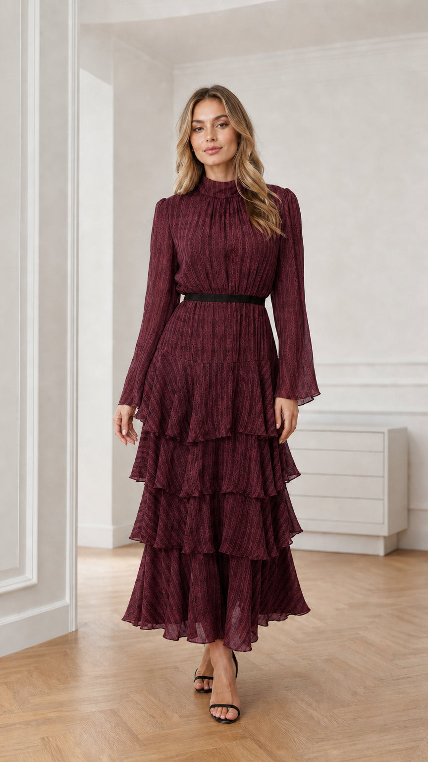 Model wearing burgundy long sleeve tiered mock neck maxi dress