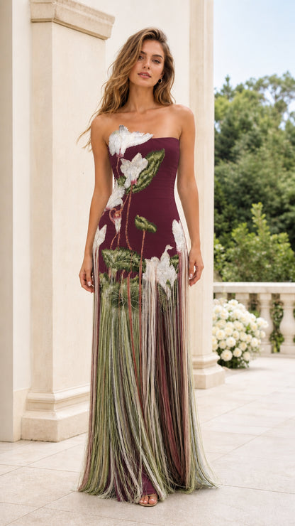 Front view of model wearing Burgundy strapless floral embroidered fringe maxi dress