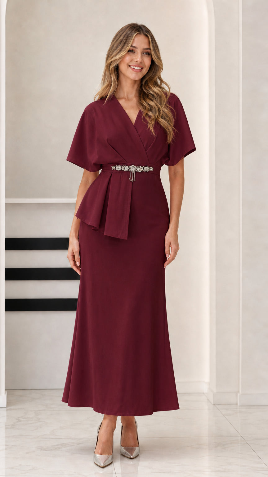 Model wearing rich Burgundy peplum formal maxi dress