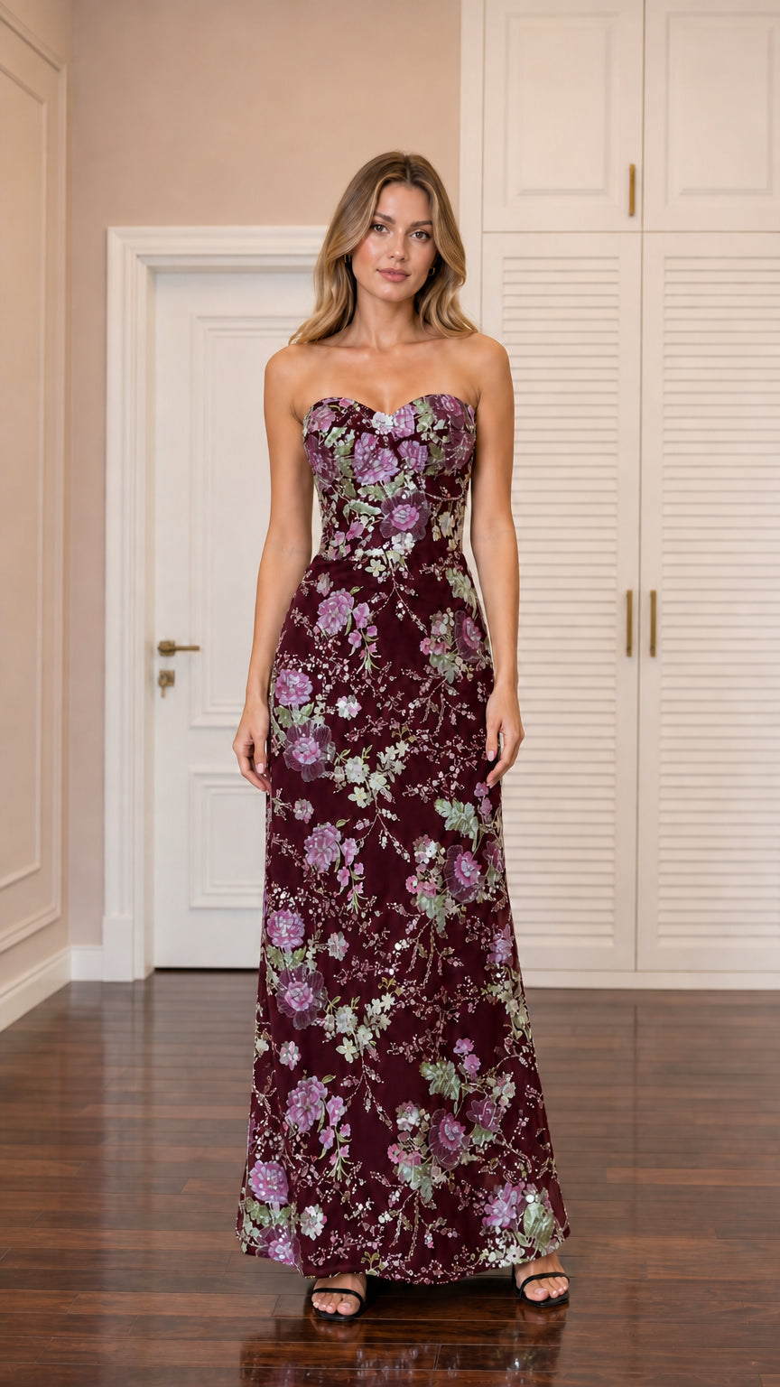 Front view of model wearing burgundy sequin embroidered strapless column gown