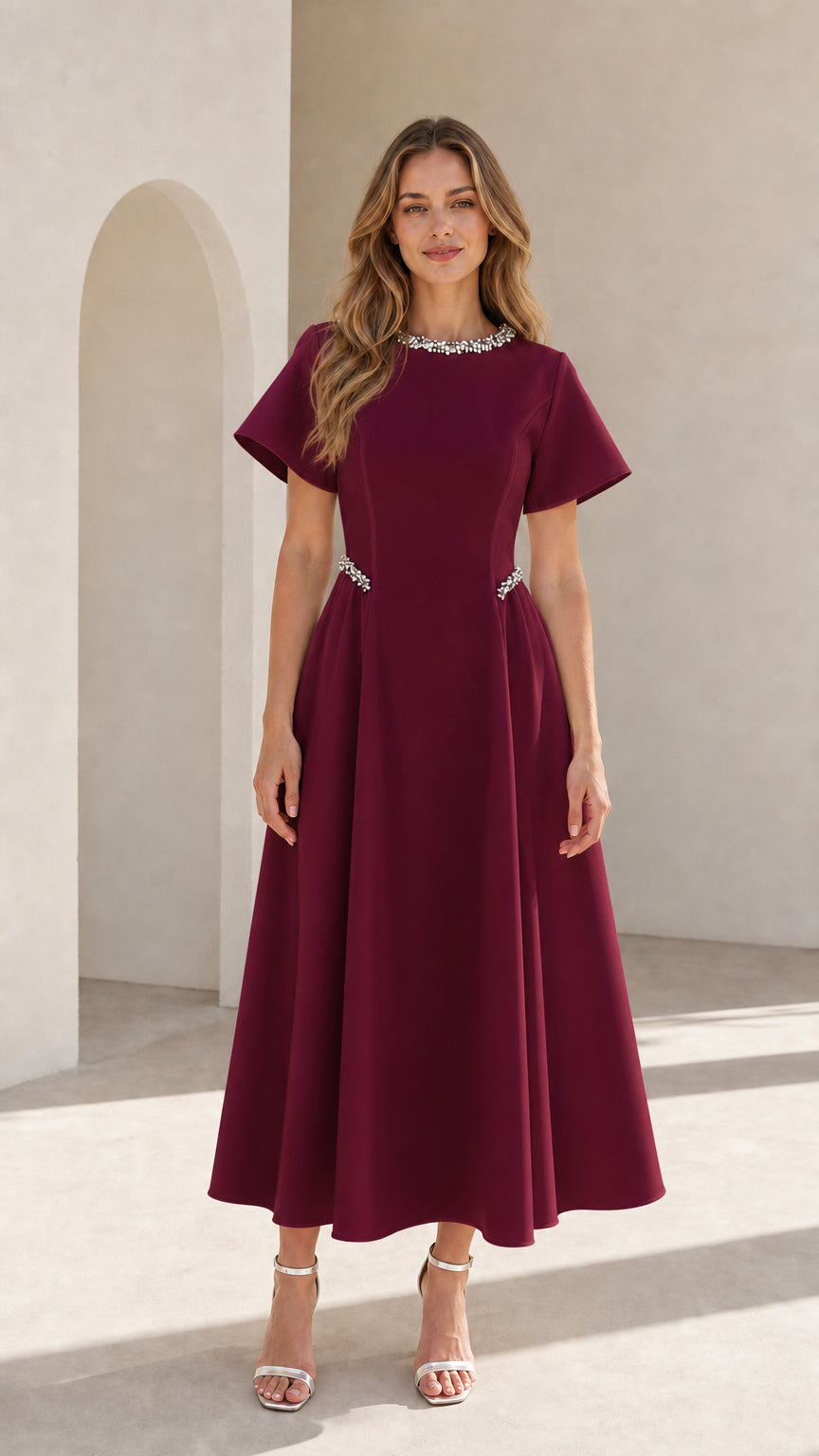 Front view of woman wearing burgundy wine pearl embellished A-line midi dress