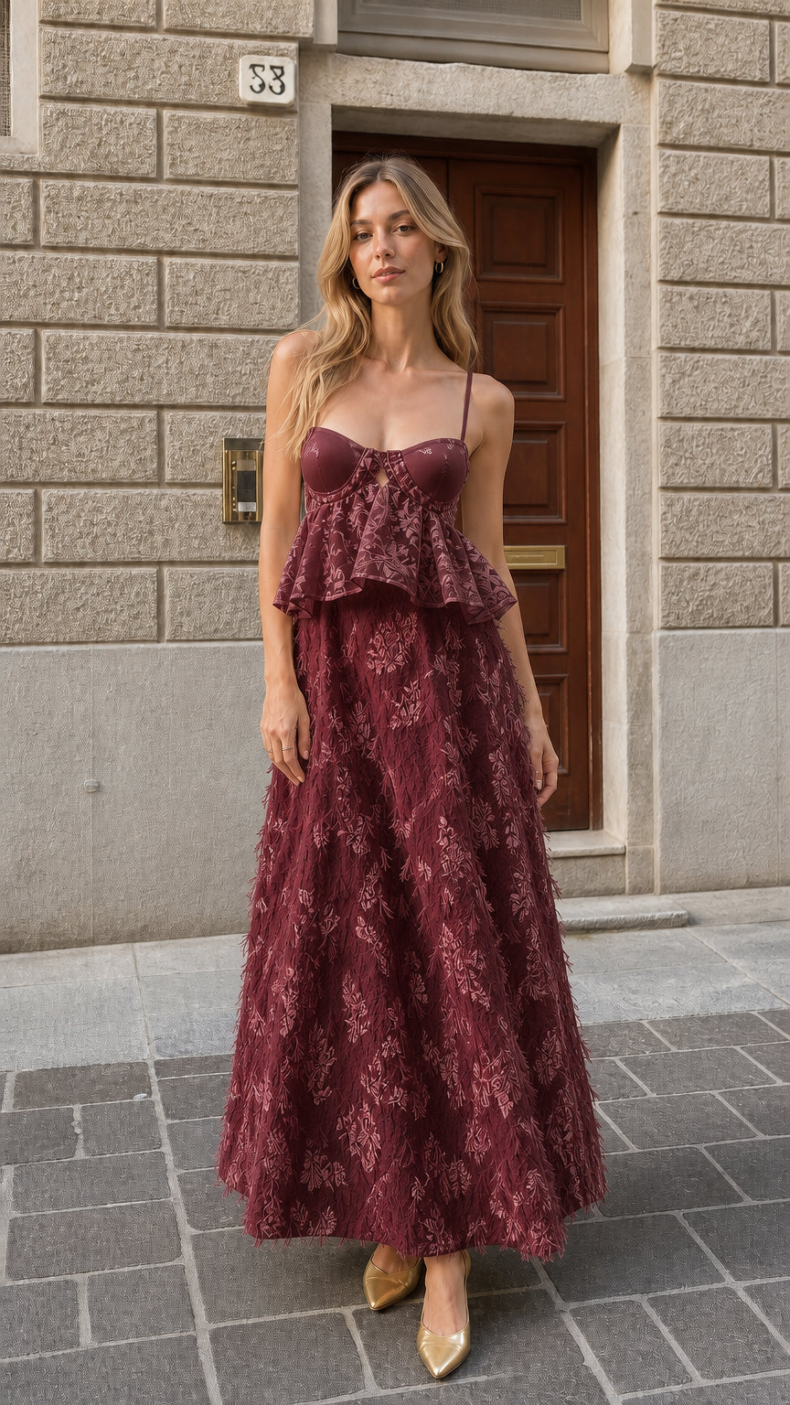 Full-length view of burgundy wine red bustier feather maxi dress