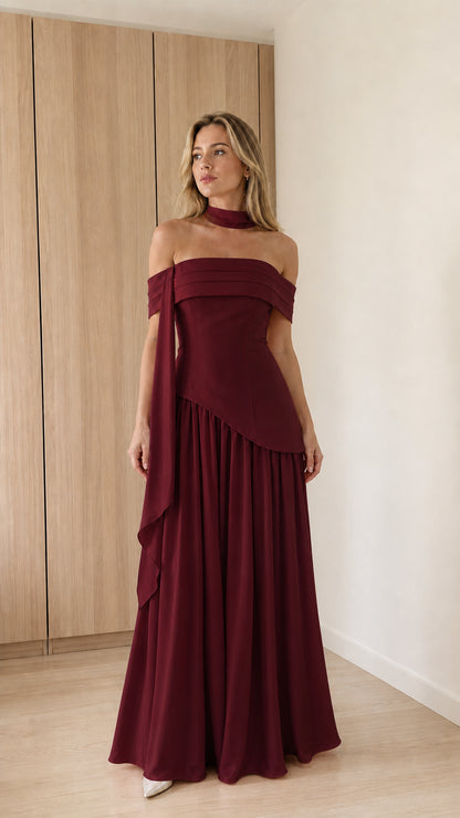 Model wearing burgundy off-the-shoulder maxi dress