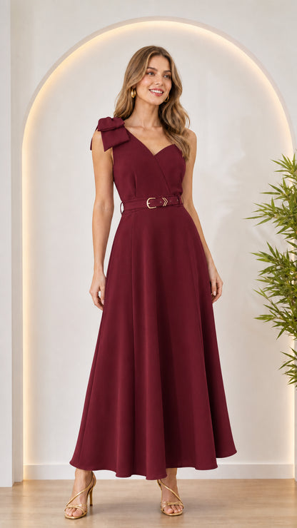 Woman wearing burgundy bow shoulder maxi dress