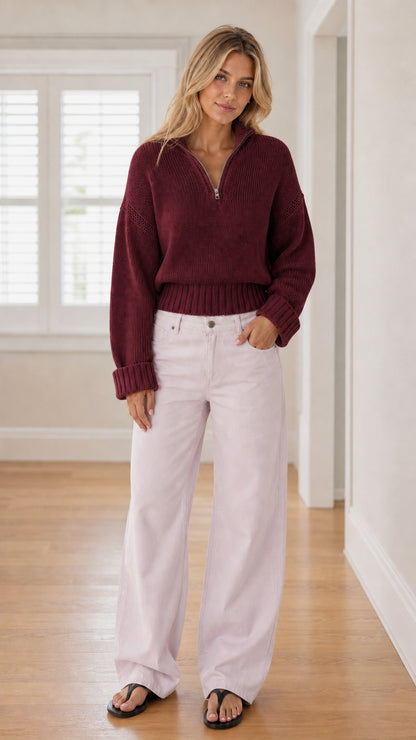 Model wearing burgundy red half-zip knit sweater