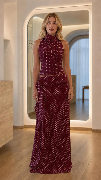 Front view of burgundy polka dot two-piece set on model