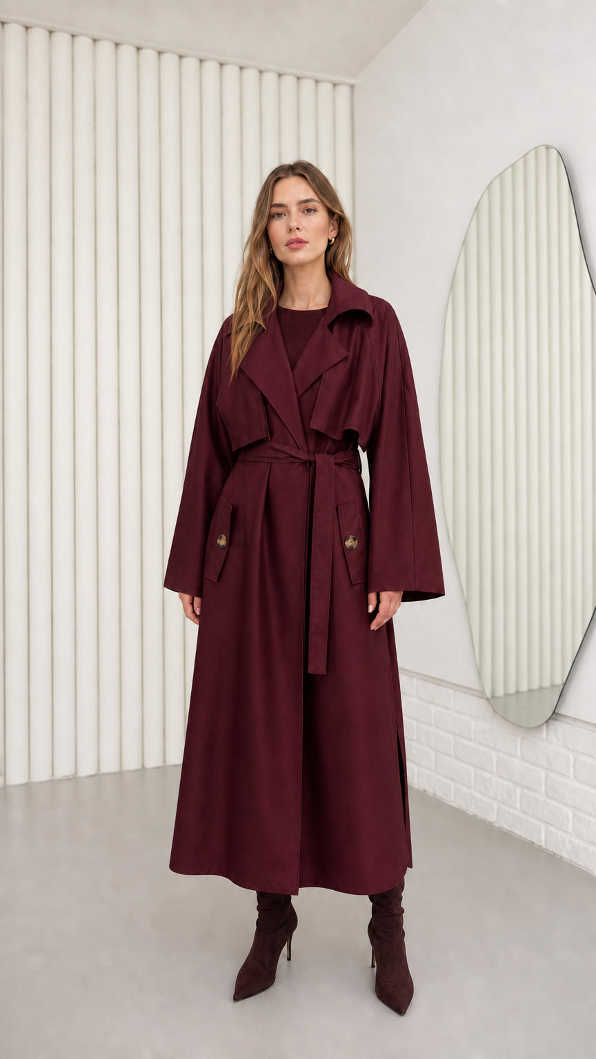 Model wearing Burgundy wine-toned belted maxi trench coat