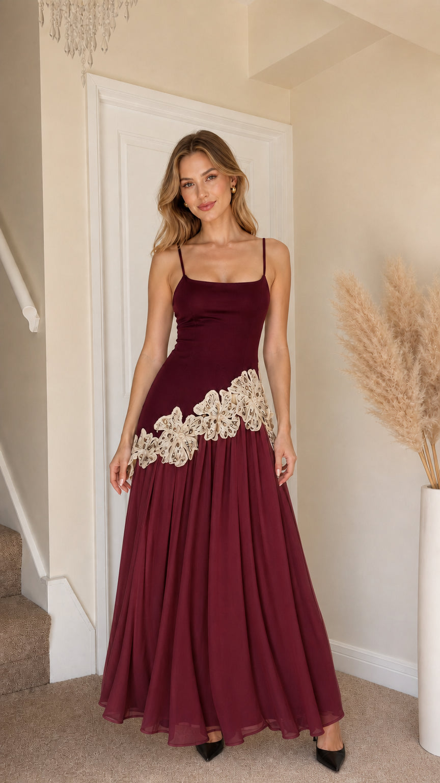 Front view of woman wearing burgundy and beige contrast long slip dress