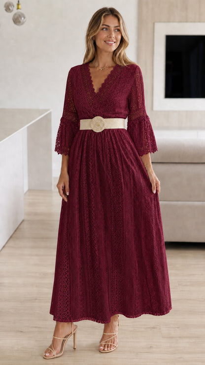 Model wearing burgundy lace maxi dress with woven belt