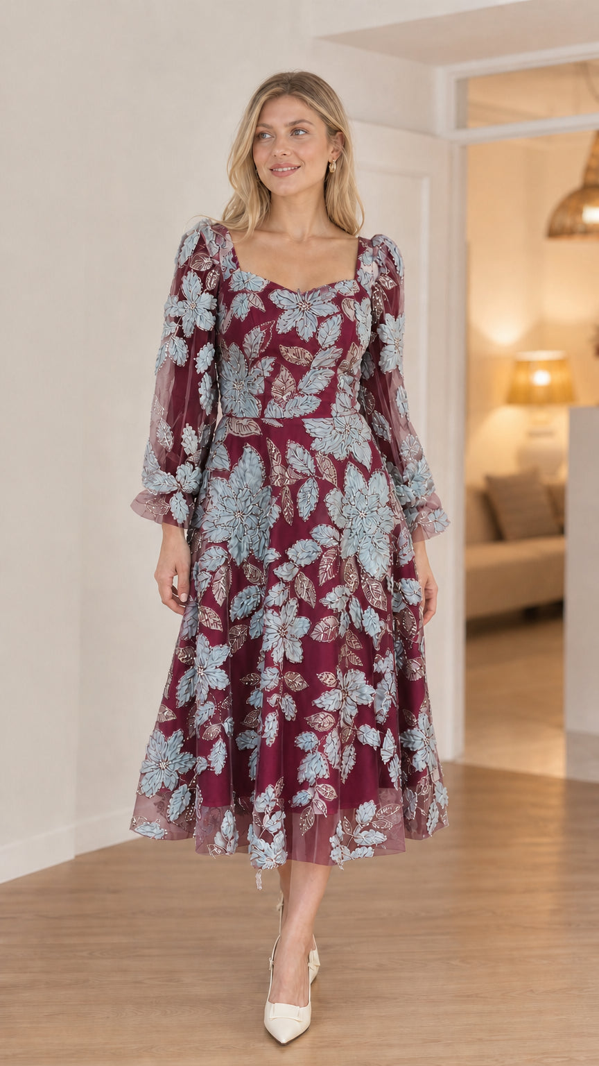 Front view of model in burgundy floral applique midi dress