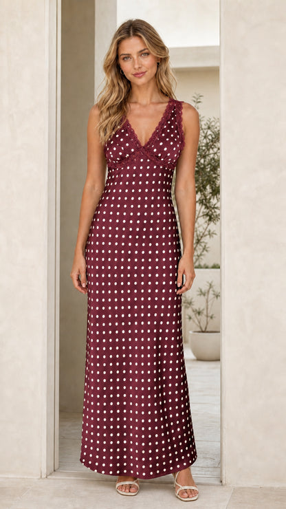Woman wearing burgundy polka dot maxi dress