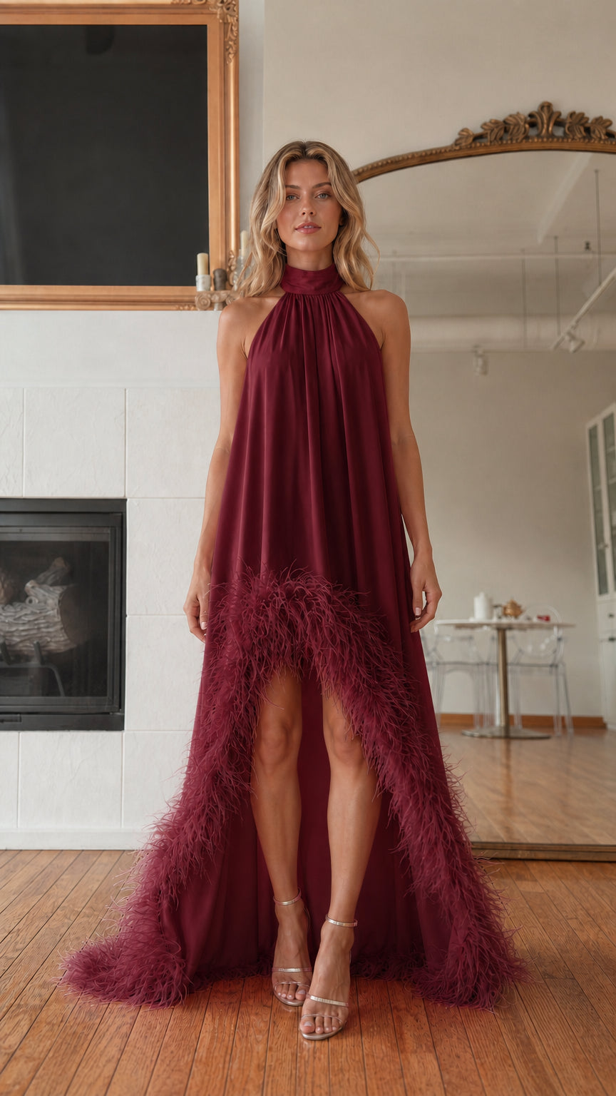 Front view of model wearing burgundy feather hem high neck maxi dress