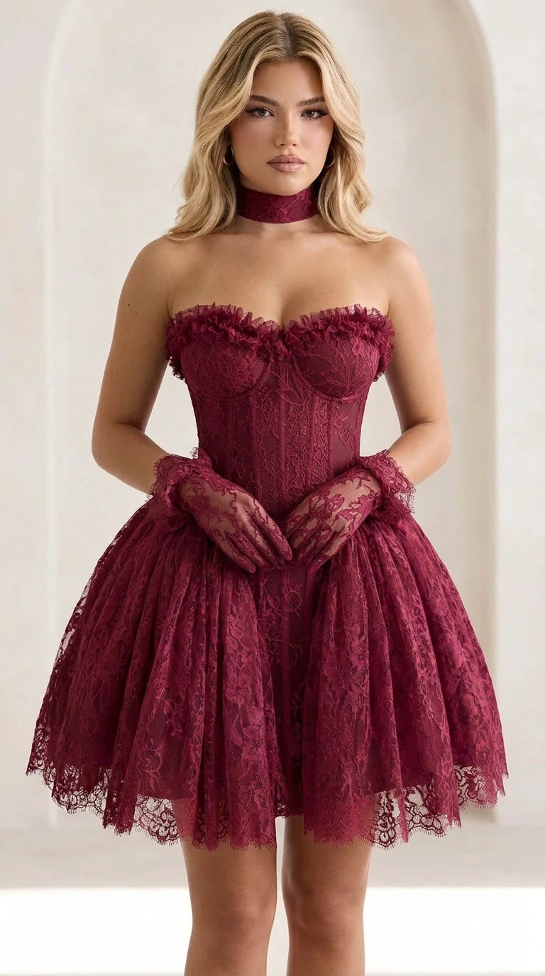 Front view of model wearing burgundy lace corset mini dress