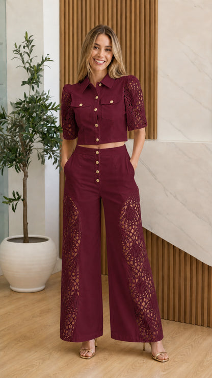 Model wearing burgundy eyelet crochet two-piece set