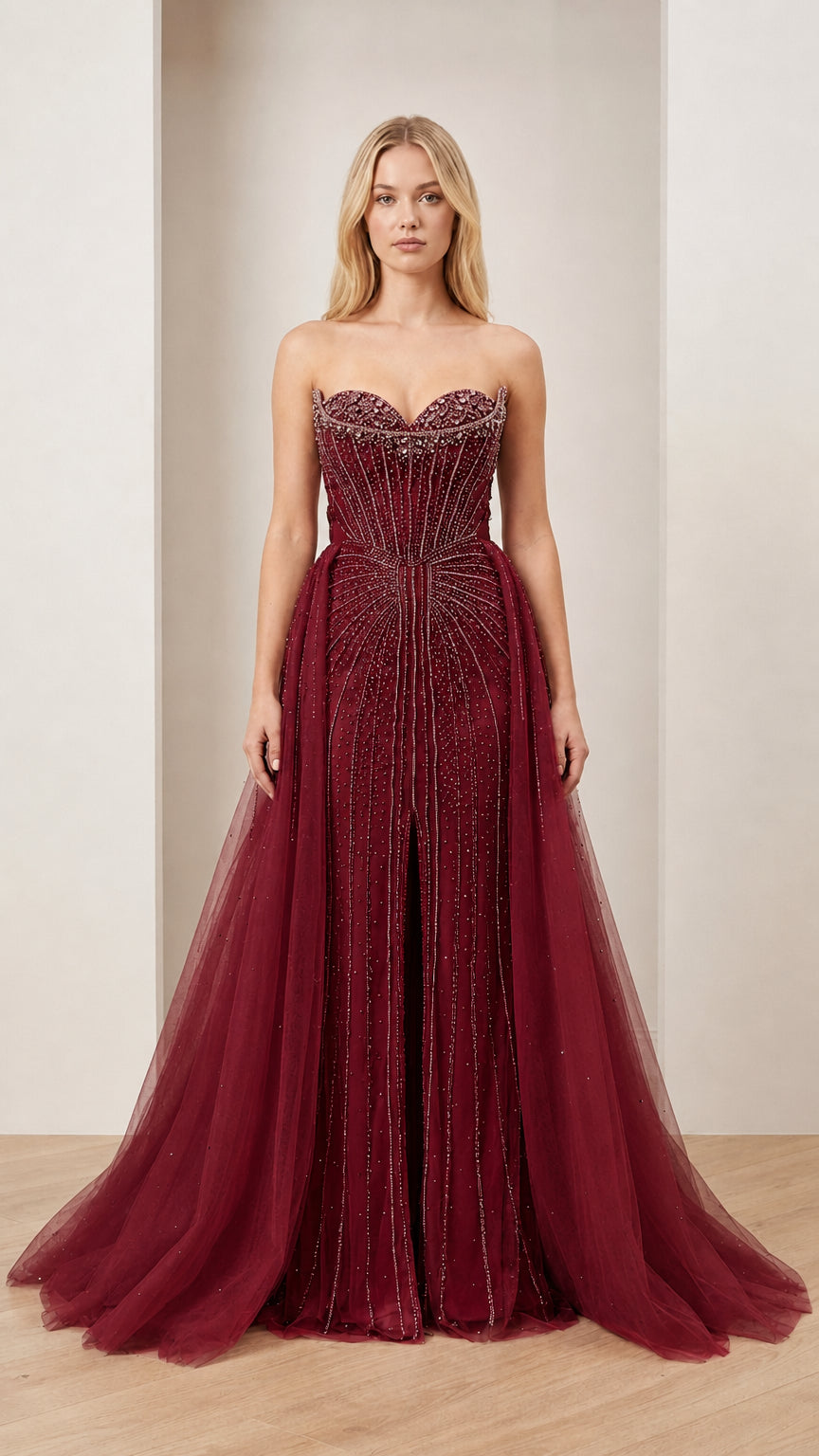 Front view of Burgundy embellished strapless ball gown