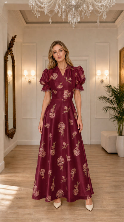 Model wearing burgundy floral embroidered maxi dress