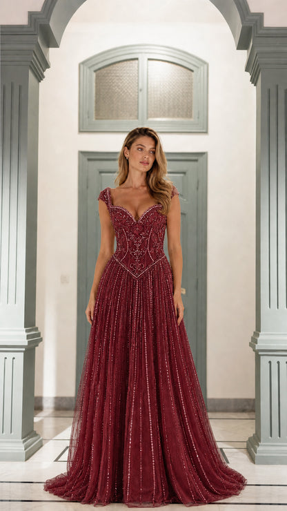 Front view of burgundy beaded formal gown