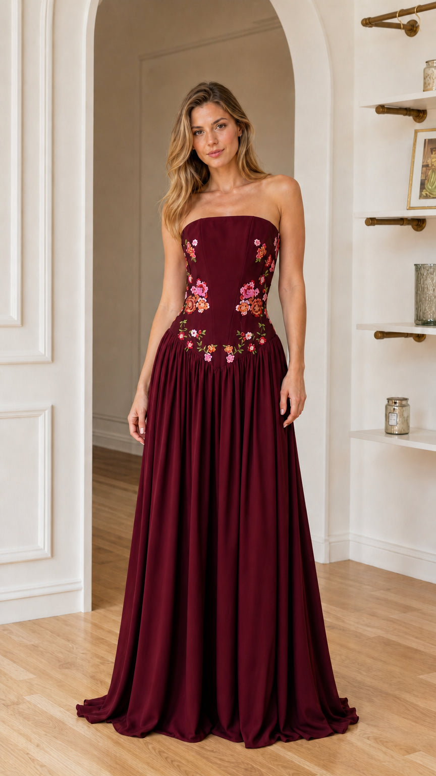 Front view of woman wearing burgundy floral embroidered maxi dress