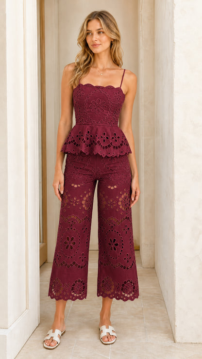 Woman wearing burgundy eyelet embroidered two-piece set