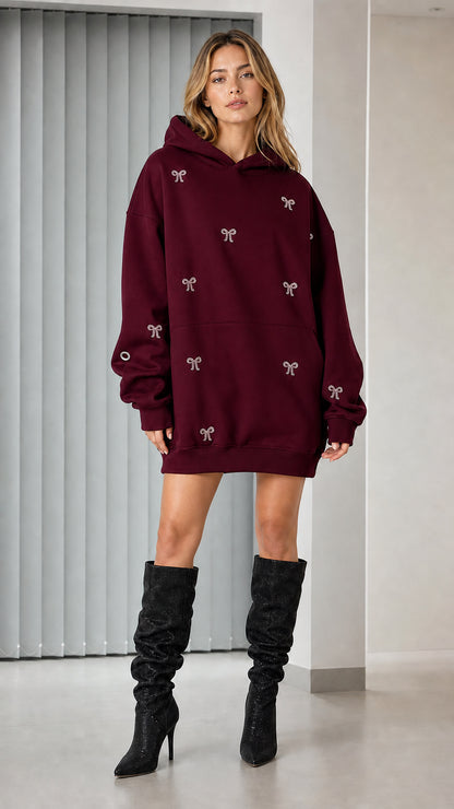 Full-length view of burgundy rhinestone bow oversized hoodie dress