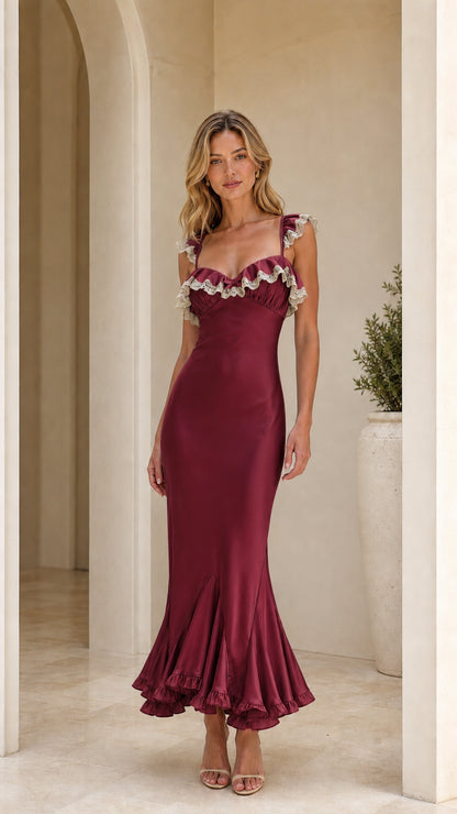 Model wearing burgundy ruffle trim maxi dress