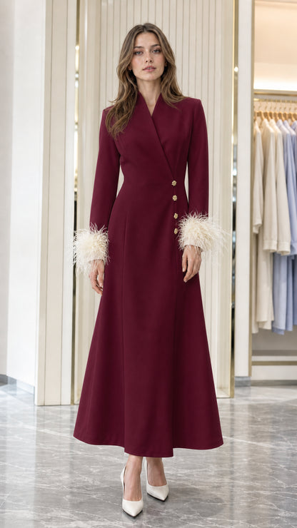 Model wearing Burgundy red long-sleeve evening coat dress with feather-trimmed cuffs