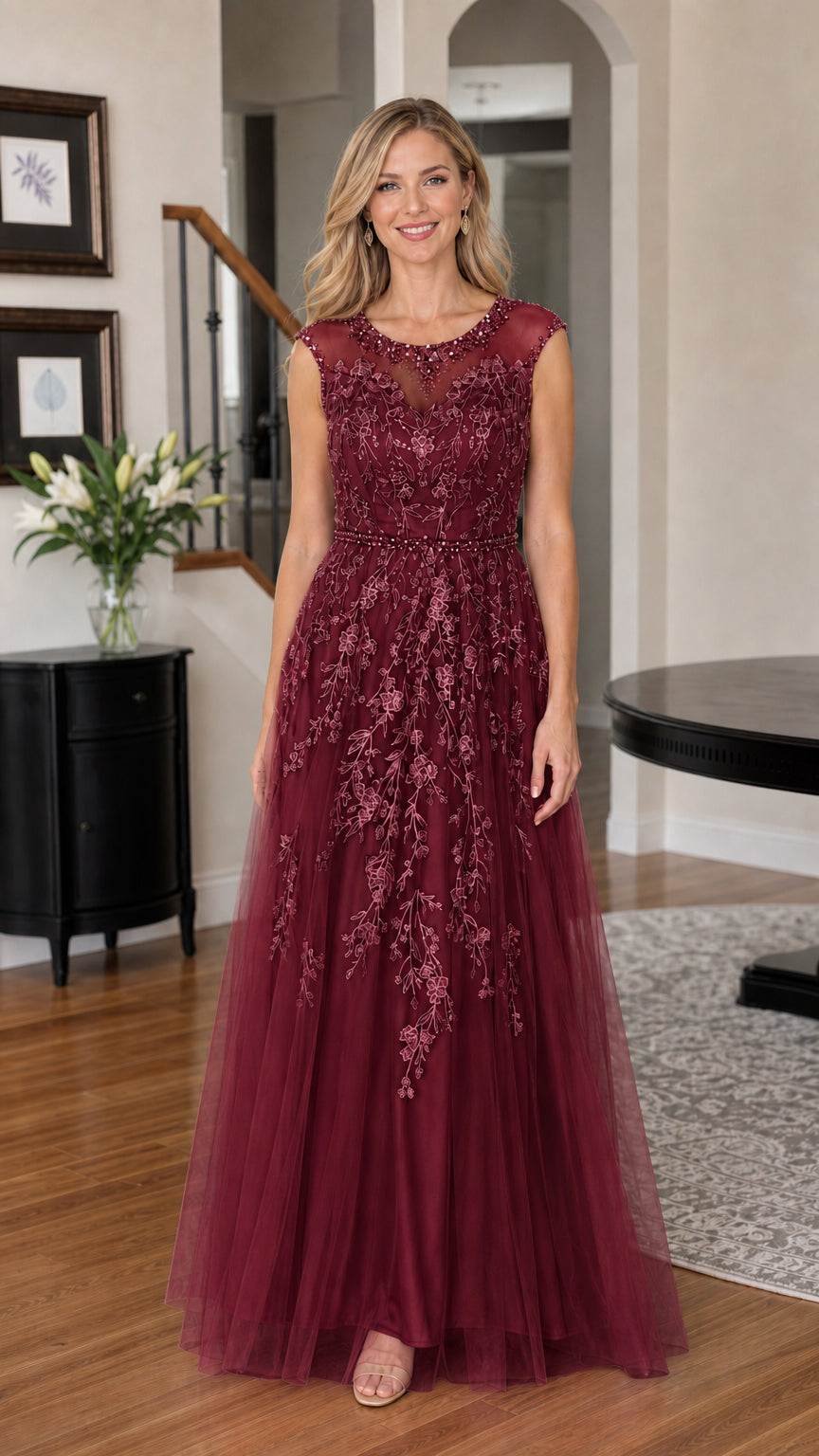 Woman wearing burgundy embroidered tulle evening gown