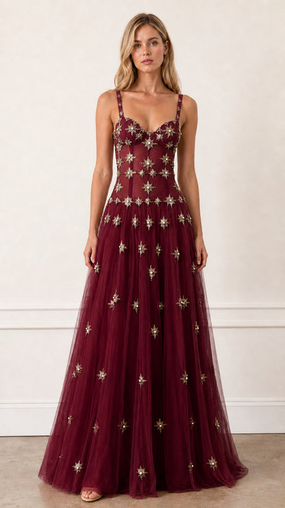 Front view of Burgundy embroidered starburst tulle evening gown