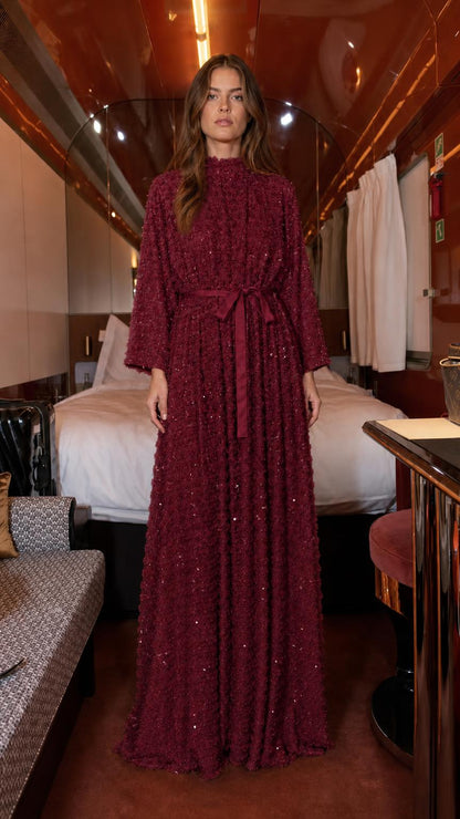 Front view of burgundy textured sequin maxi dress