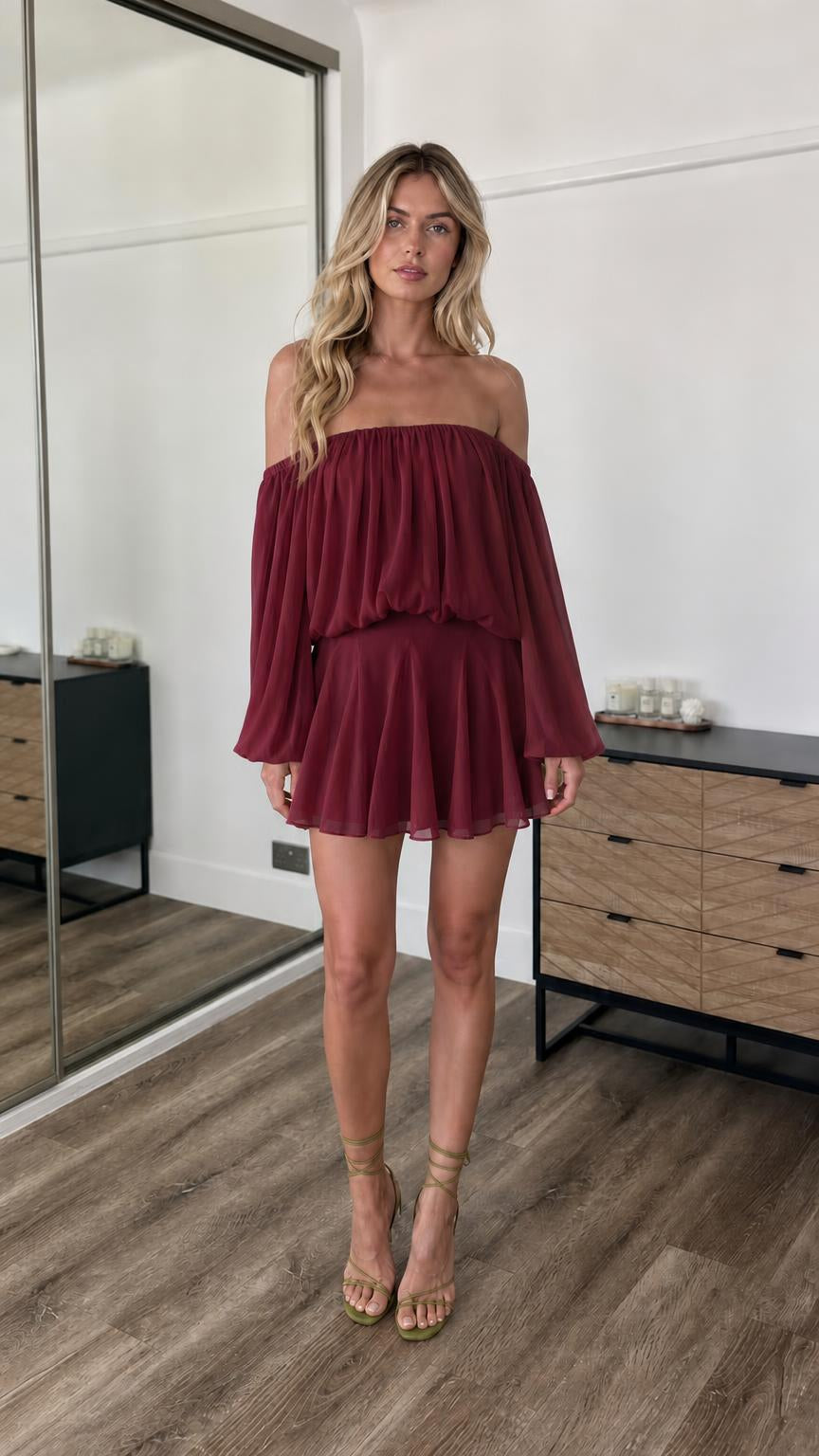 Front view of model wearing burgundy off-the-shoulder mini dress