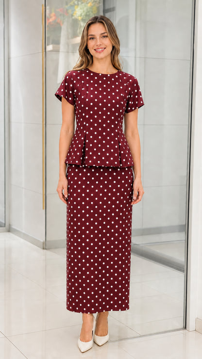 Front view of burgundy polka dot two piece set on model