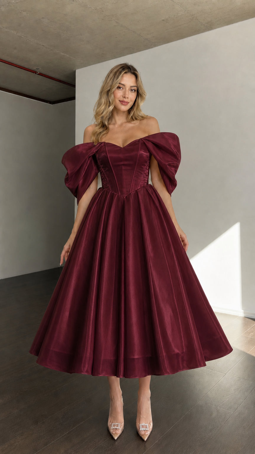 Front view of woman wearing burgundy off-shoulder corset midi dress