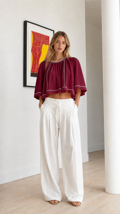 Front view of burgundy wine embroidered cropped blouse with wide-leg pants
