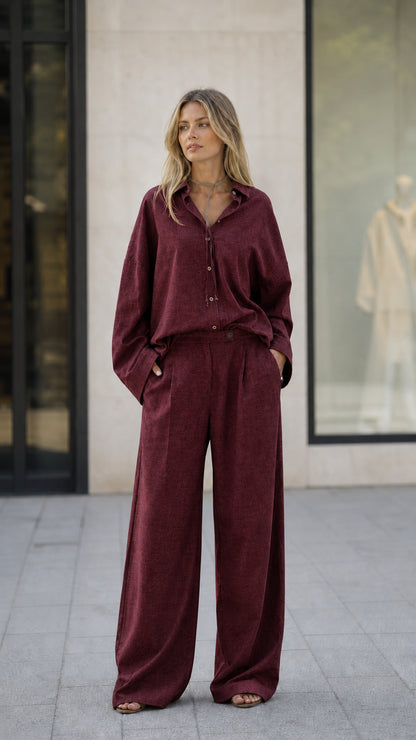 Full-length view of woman in burgundy matching set