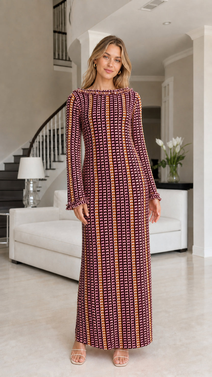 Front view of model wearing burgundy striped crochet maxi dress