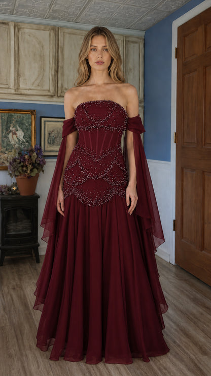 Front view of burgundy red beaded off-shoulder evening gown