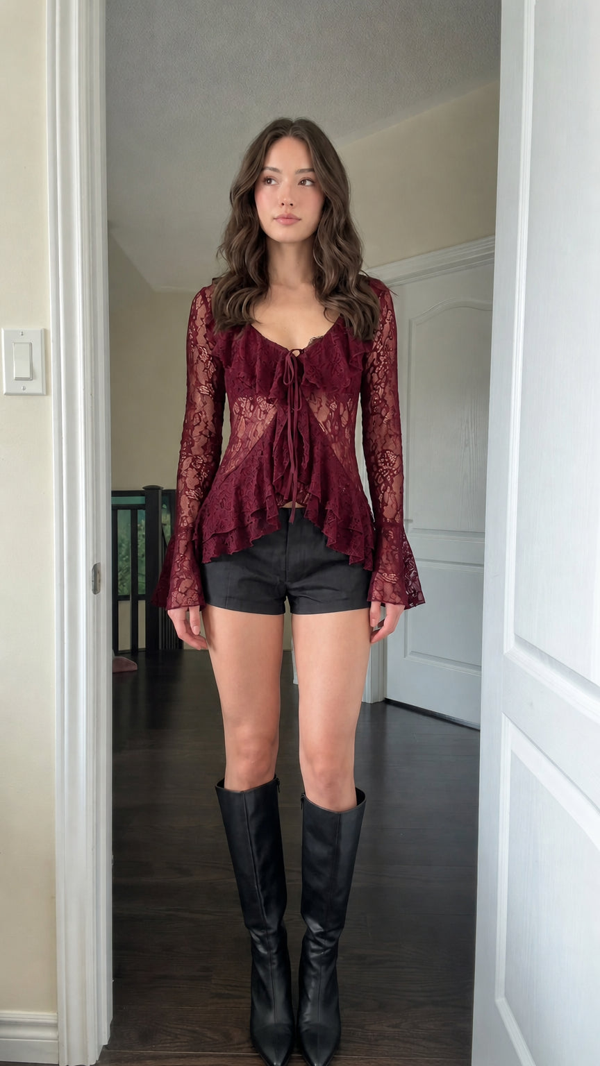 Model wearing Burgundy sheer lace ruffle tie-front blouse
