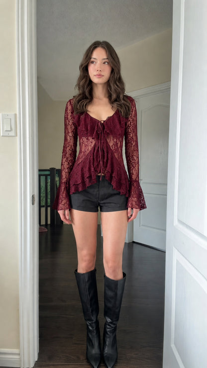 Model wearing Burgundy sheer lace ruffle tie-front blouse