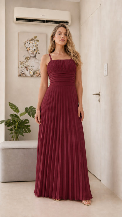 Front view of model wearing the burgundy pleated maxi dress