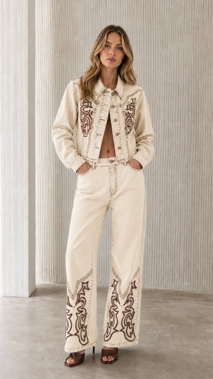 Full view of model wearing off-white embroidered denim set