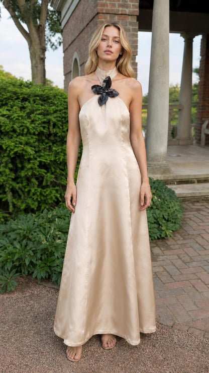 Full front view of model in champagne satin halter maxi dress